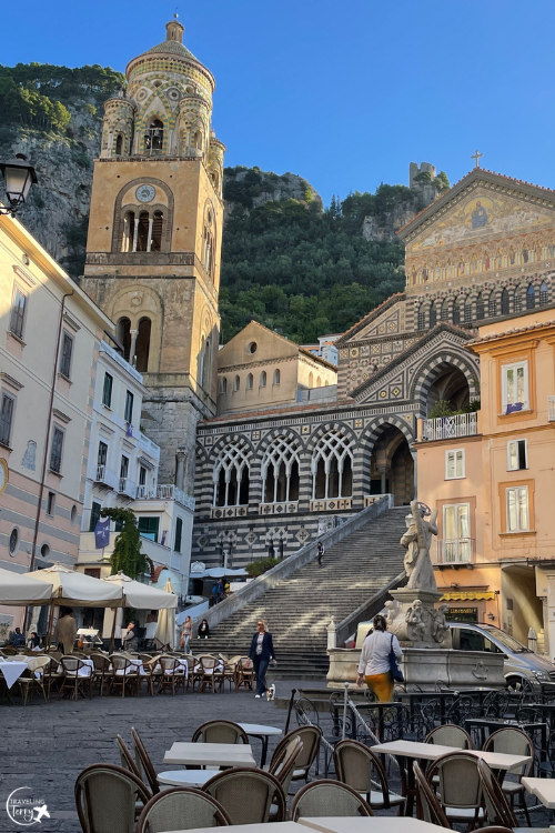 view of the main square of Amalfi, Italy with a large staircase leading up to a church