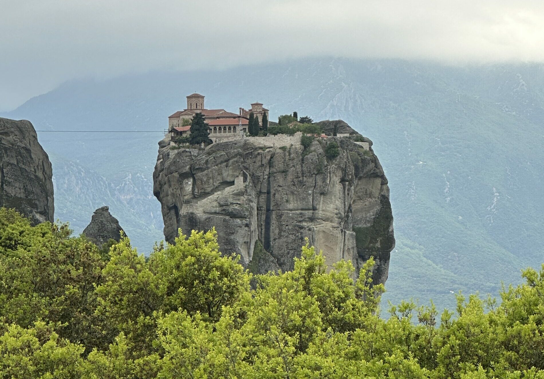 A Meteora monastery perched on the cliffs in Meteora